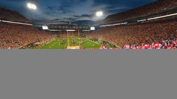 Clemson football players prepare to run down the hill into the stadium
